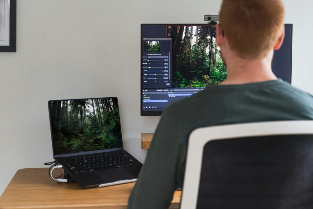 A man editing video on a MacBook