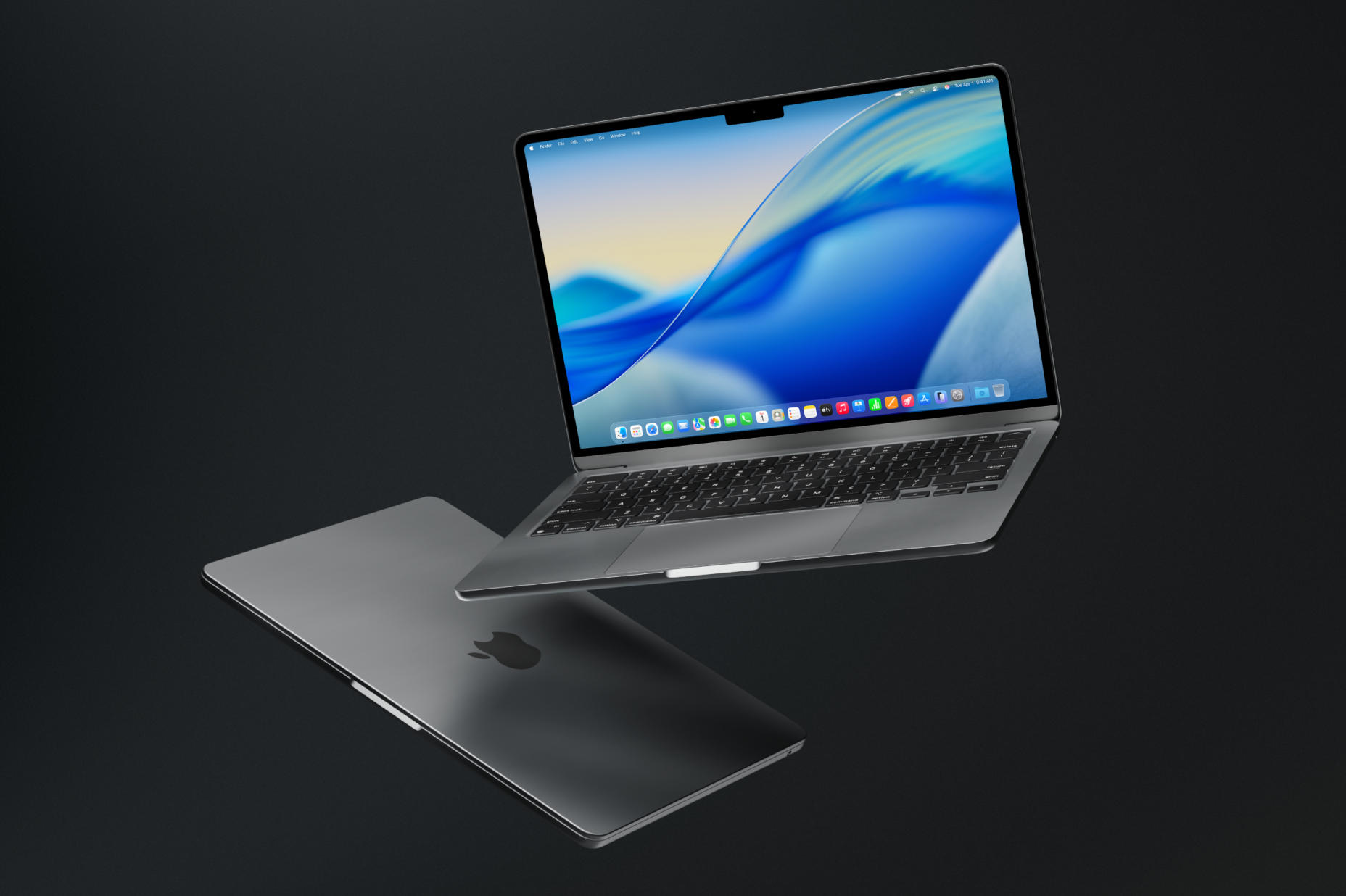 Two MacBooks floating in the air